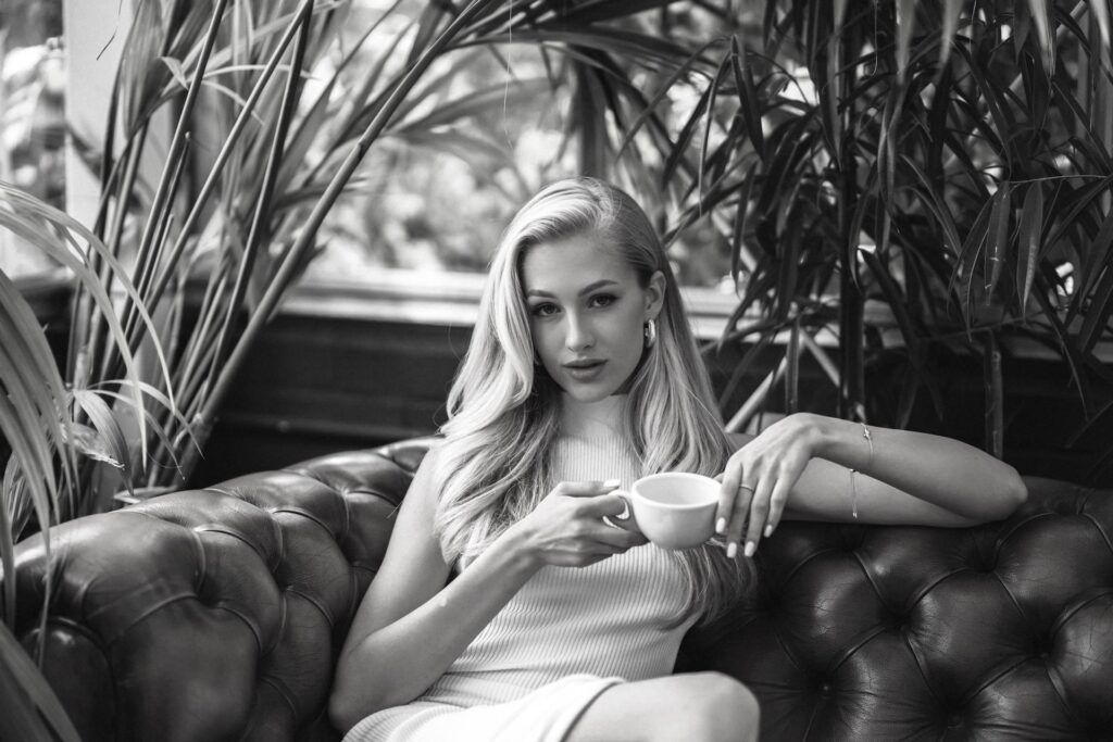 A beautiful woman drinking coffee.