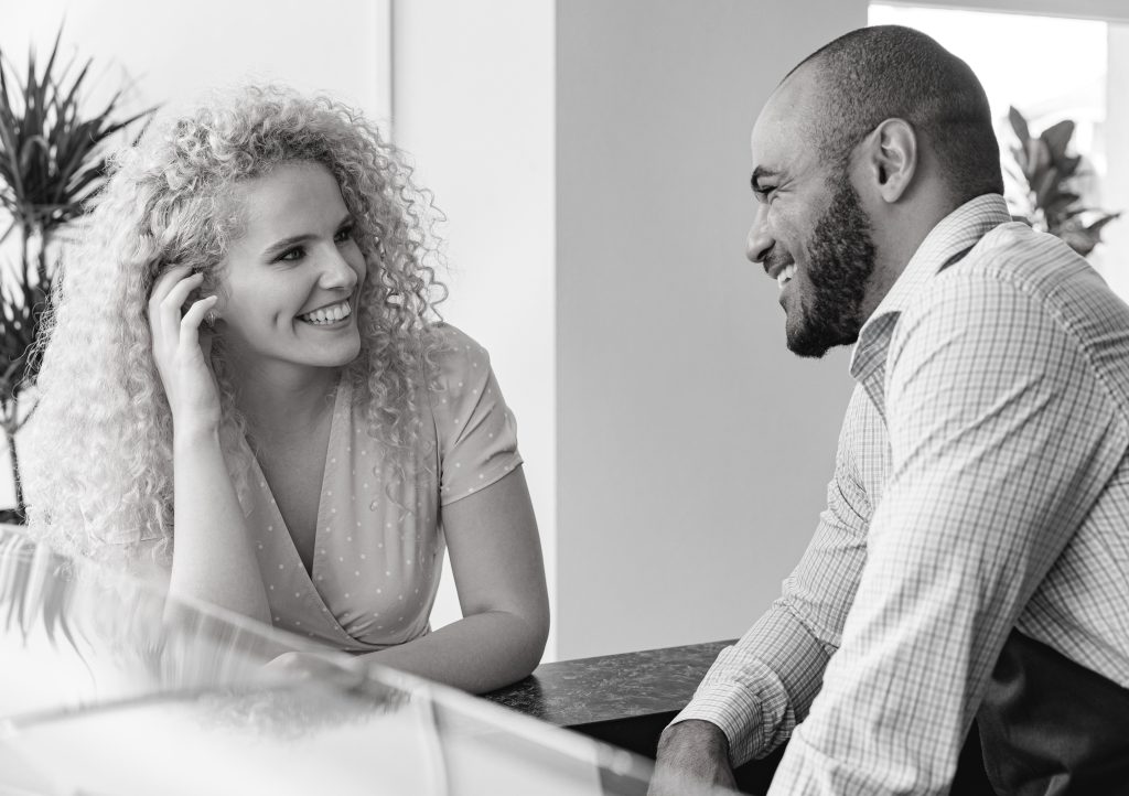 A couple having a conversation in a coffee shop