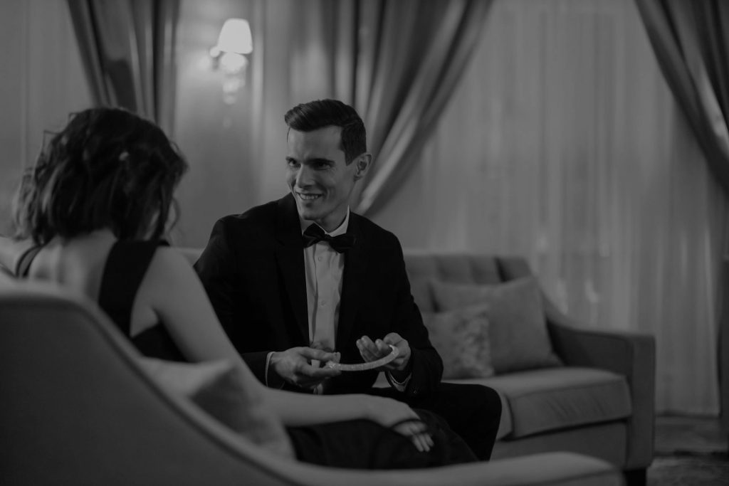 An elegant couple in a hotel lobby